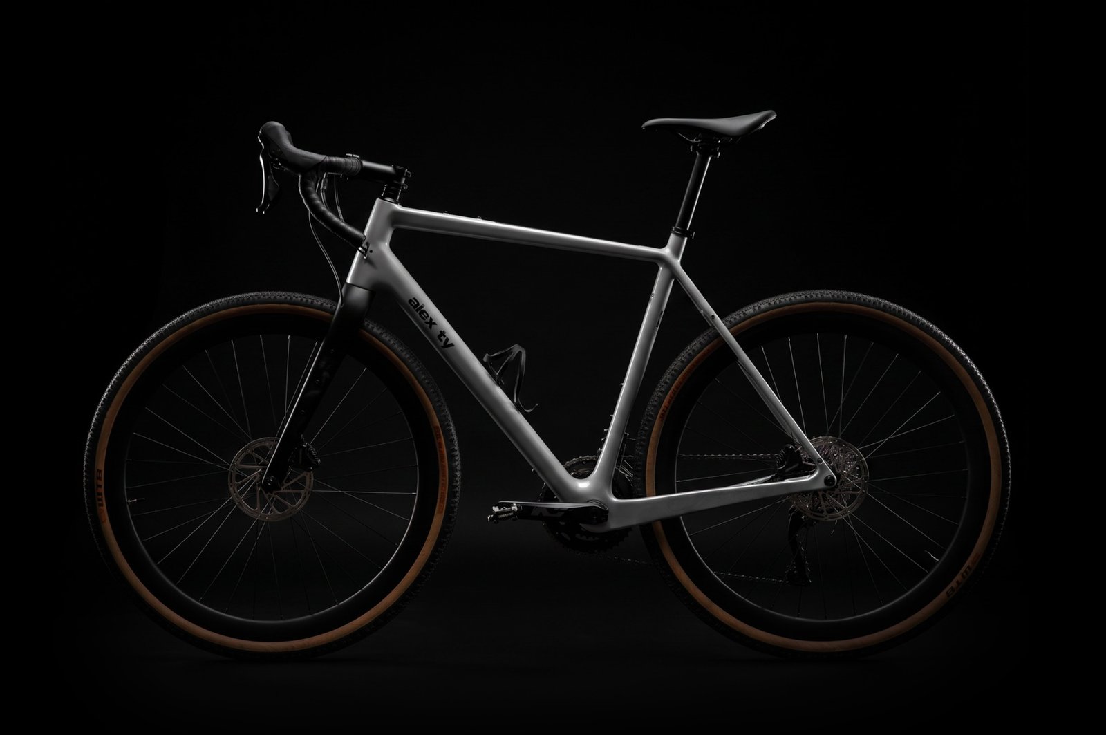 Alex Ty men’s gravel bicycle emerging from darkness